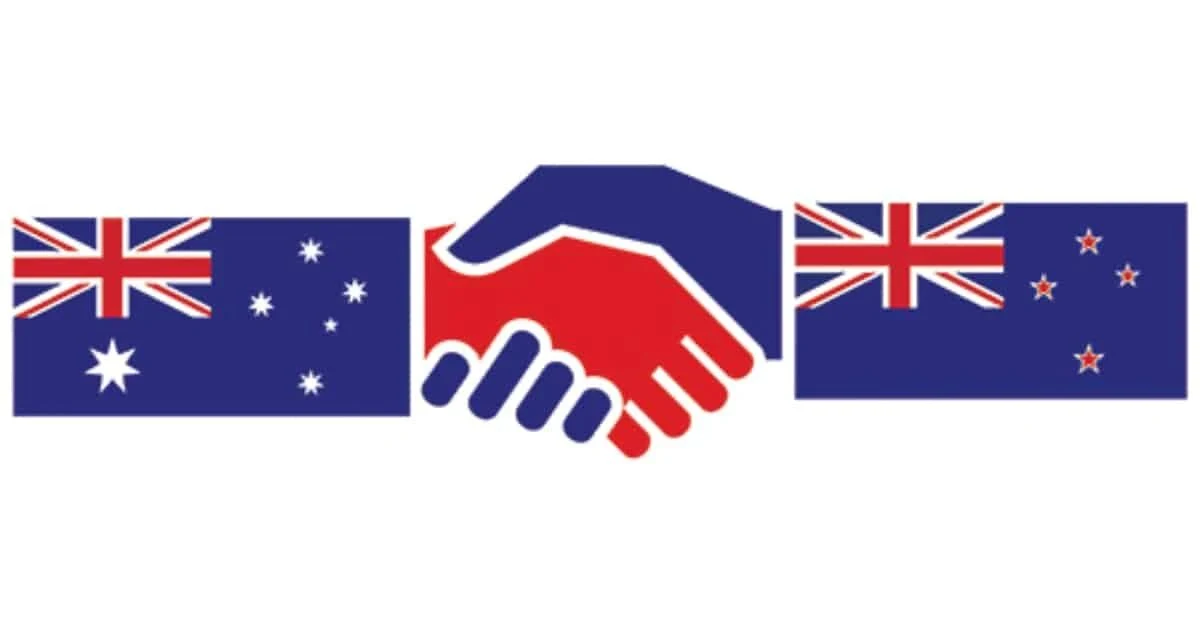 Australian and New Zealand flags with a handshake, representing travel and ties between the two countries
