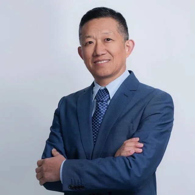 Professional portrait of licensed immigration adviser Lloyd Gao